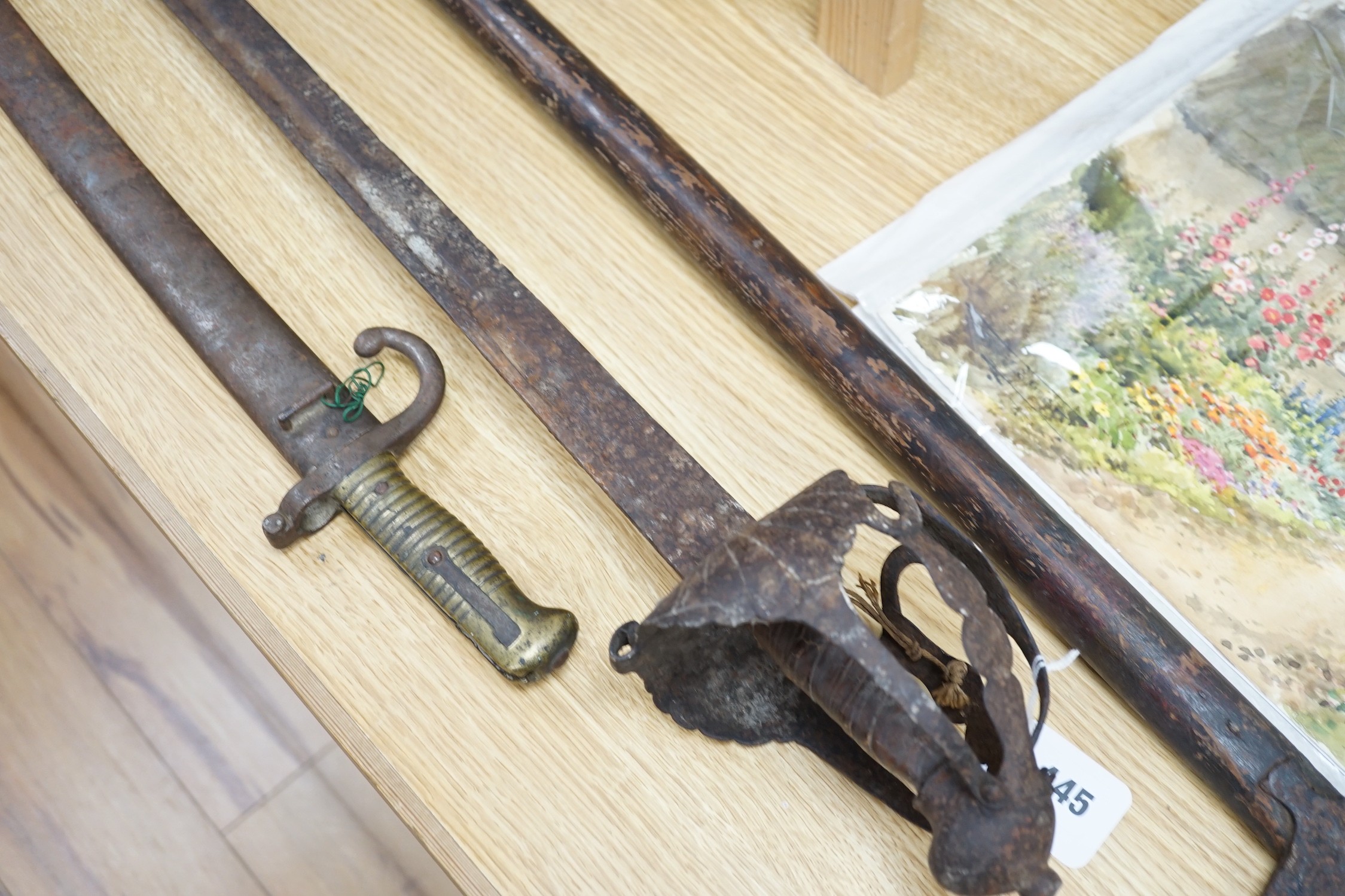 An early pike, a basket hilt sword and a French bayonet. longest 193cm